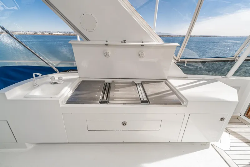 Slide: The Image of Outdoor kitchen on 1995 Nordlund Cockpit Motor Yacht with ocean view. - 17