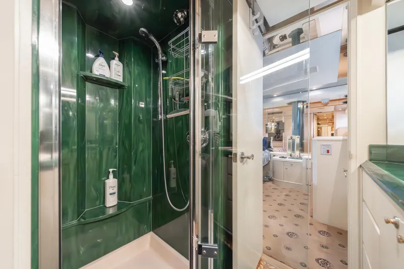 Slide: The Image of Luxurious bathroom in 1995 Nordlund Cockpit Motor Yacht with green shower and modern amenities. - 41