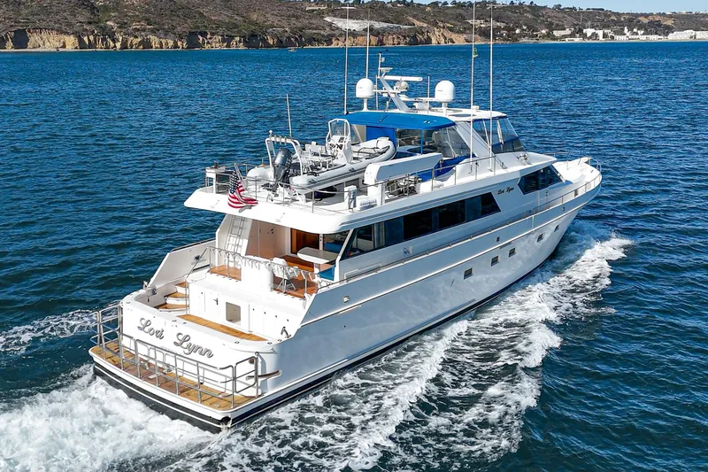 Slide: The Image of Nordlund 1995 Cockpit Motor Yacht cruising on blue ocean waters. - 8