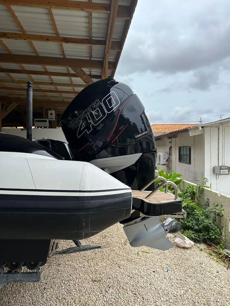 Slide: The Image of 2019 Technohull SeaDNA 999 G5 with powerful 400HP engine, parked under a shelter. - 14