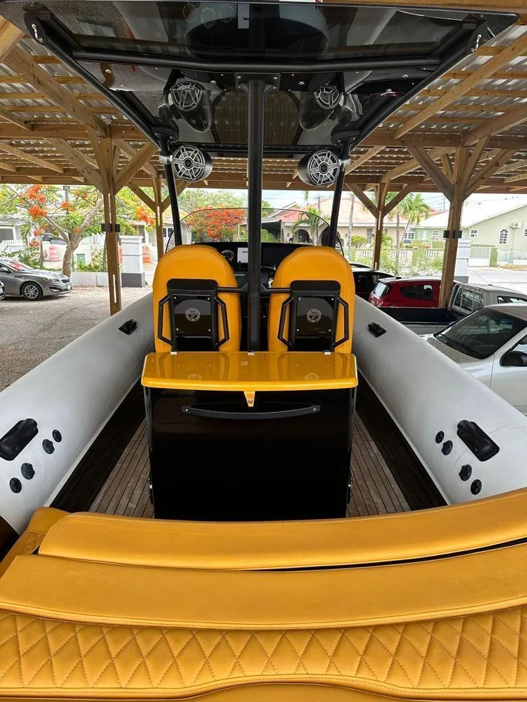 Slide: The Image of 2019 Technohull SeaDNA 999 G5 boat interior with yellow seating and modern design. - 16