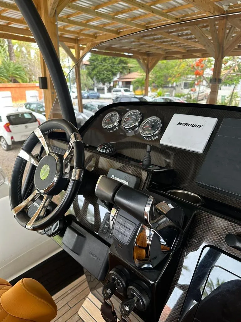 Slide: The Image of 2019 Technohull SeaDNA 999 G5 dashboard with Mercury controls and gauges. - 17