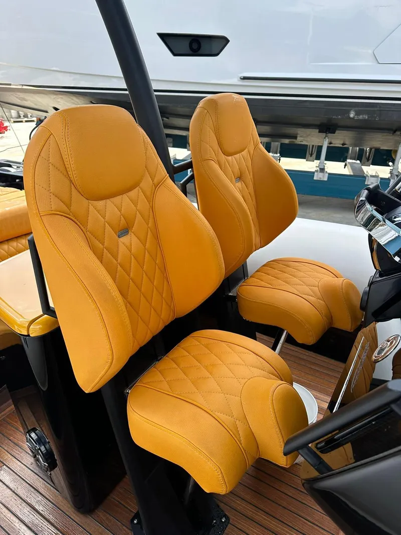 Slide: The Image of Luxurious orange seats on 2019 Technohull SeaDNA 999 G5 boat. - 3