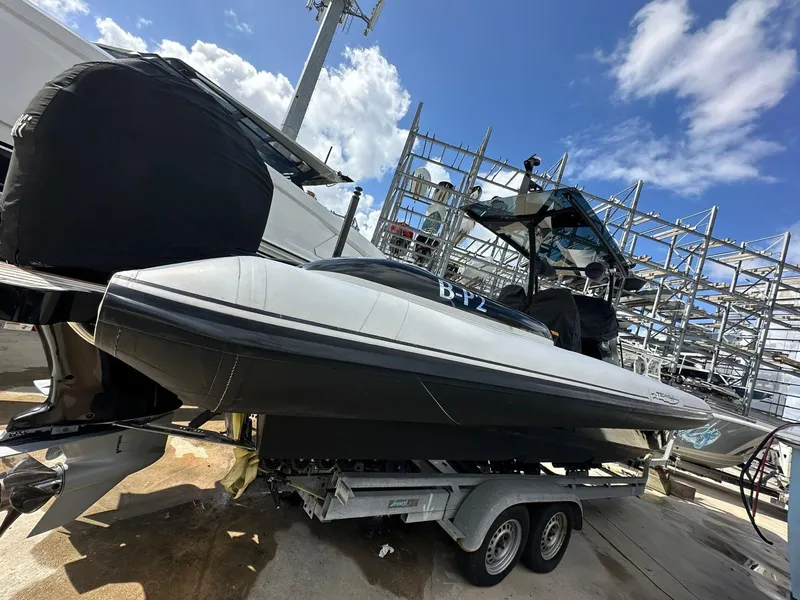 Slide: The Image of 2019 Technohull SeaDNA 999 G5 boat on trailer under blue sky. - 7