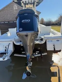 Slide: The Image of 2019 NauticStar 244XTS boat with powerful 250 engine, rear view. - 12