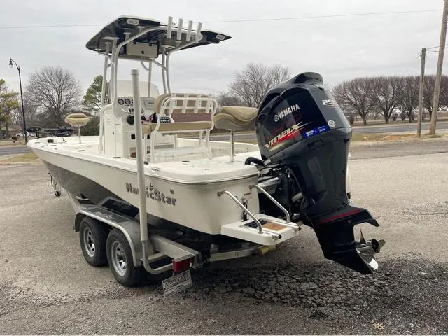 Slide: The Image of 2019 NauticStar 244XTS boat on trailer with Yamaha outboard motor. - 15