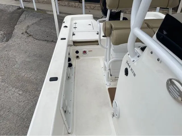 Slide: The Image of 2019 NauticStar 244XTS boat interior with seating and console details. - 18