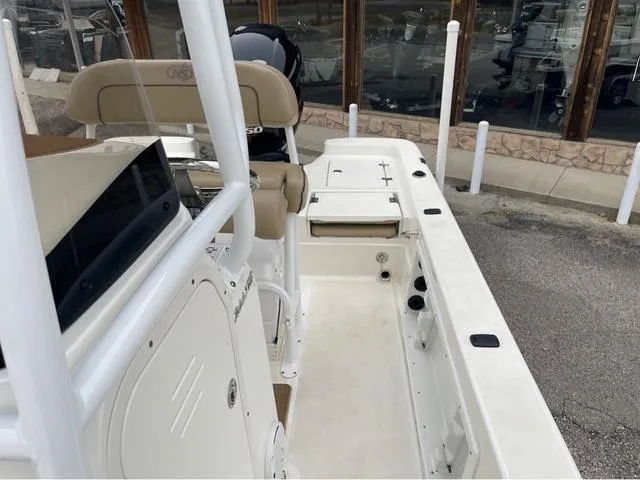Slide: The Image of 2019 NauticStar 244XTS boat interior with seating and storage compartments. - 19
