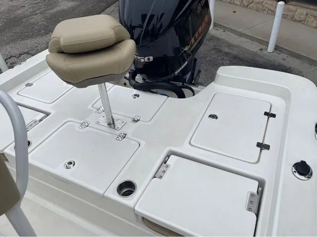 Slide: The Image of 2019 NauticStar 244XTS boat deck with seating and storage compartments. - 27