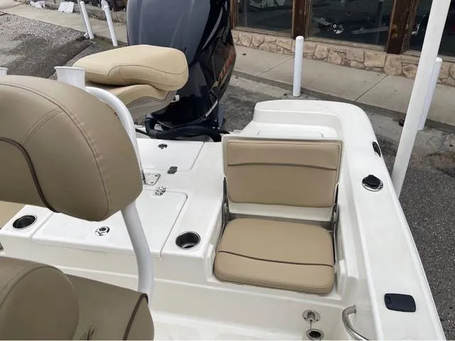 Slide: The Image of 2019 NauticStar 244XTS boat with beige seating and sleek design. - 29