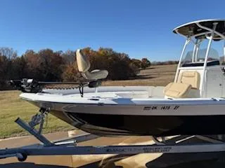 Slide: The Image of 2019 NauticStar 244XTS boat dashboard with steering wheel and control panel. - 3