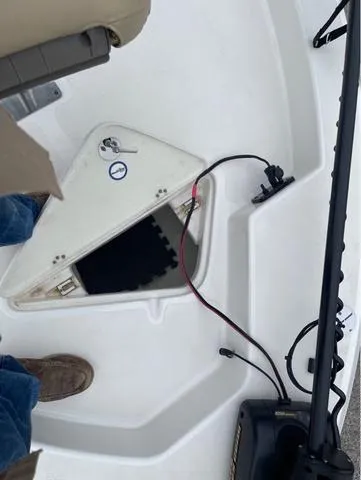 Slide: The Image of Open hatch on 2019 NauticStar 244XTS boat deck with visible wiring. - 37