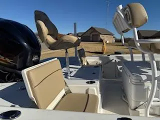 Slide: The Image of 2019 NauticStar 244XTS boat interior with seating and storage compartments. - 5