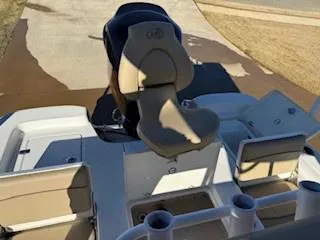 Slide: The Image of Close-up of 2019 NauticStar 244XTS boat control panel under clear blue sky. - 6