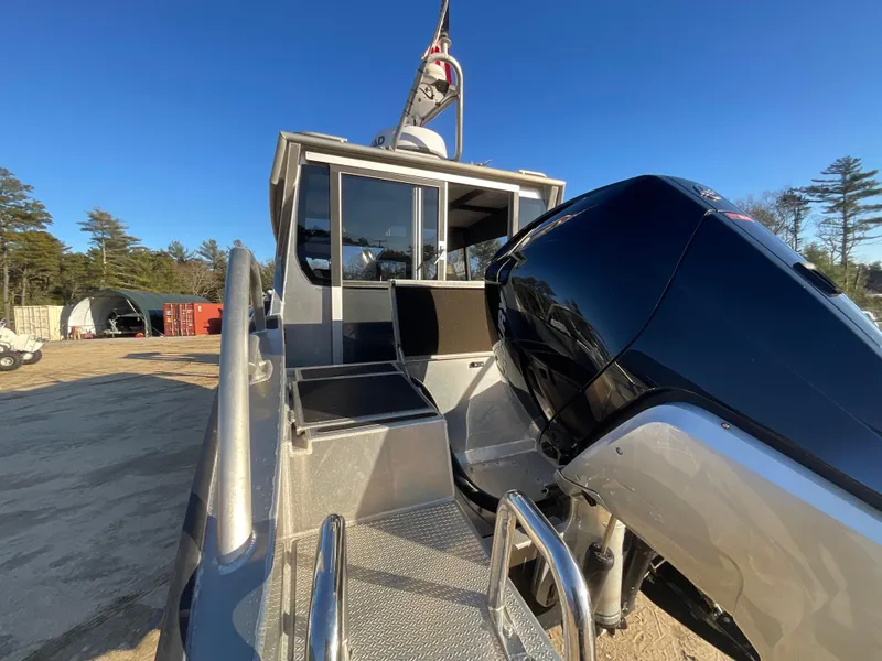 Slide: The Image of 2023 Viggo C8 boat with powerful outboard motor, docked under clear blue sky. - 10