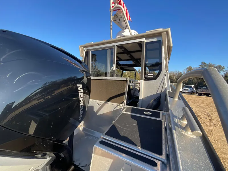 Slide: The Image of 2023 Viggo C8 boat with Mercury engine, docked under clear blue sky. - 11