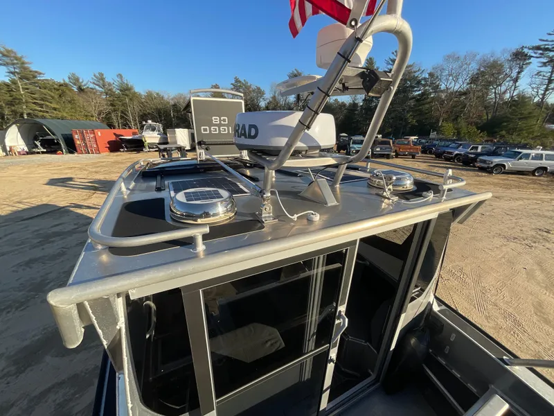 Slide: The Image of 2023 Viggo C8 boat with radar equipment and American flag on deck. - 13