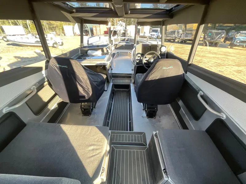 Slide: The Image of Interior of 2023 Viggo C8 boat with modern seating and controls. - 14