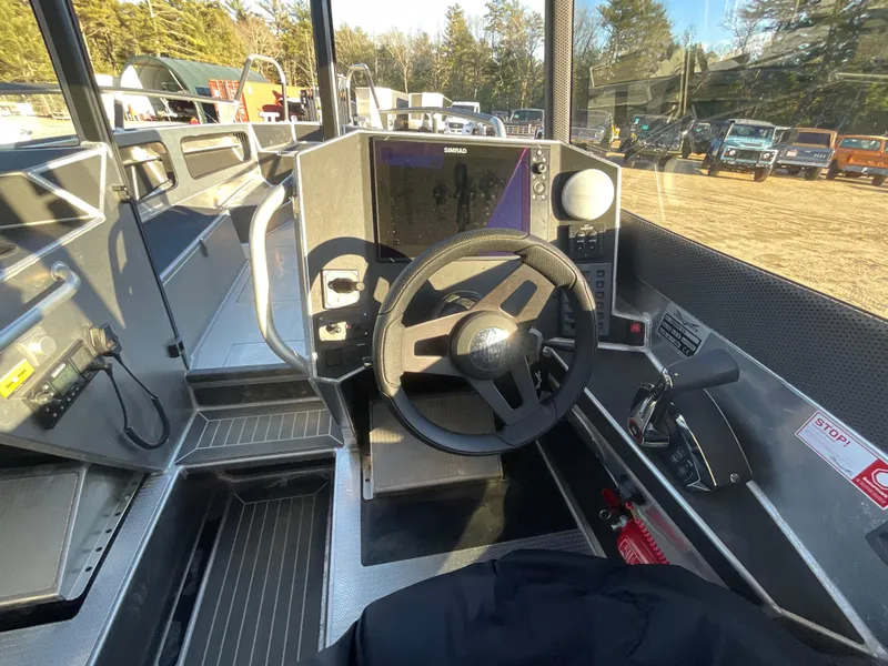 Slide: The Image of Viggo C8 2023 boat cockpit with steering wheel and navigation system. - 17