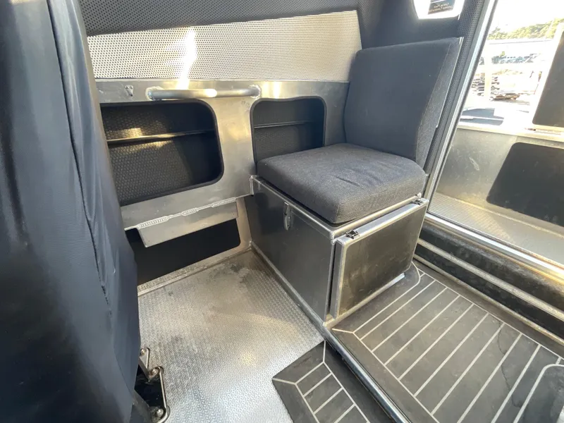 Slide: The Image of Interior of 2023 Viggo C8 vehicle with metal and fabric seating. - 27