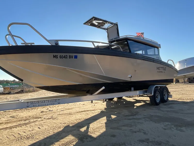 Slide: The Image of 2023 Viggo C8 boat on trailer in sunny outdoor setting. - 4