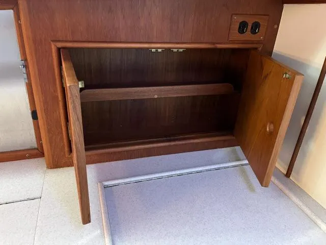 Slide: The Image of Wooden cabinet interior on 1999 Grand Banks Eastbay 38 yacht. - 13