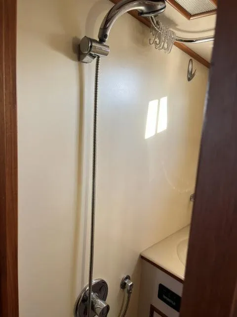 Slide: The Image of Shower area in 1999 Grand Banks Eastbay 38 yacht bathroom. - 32