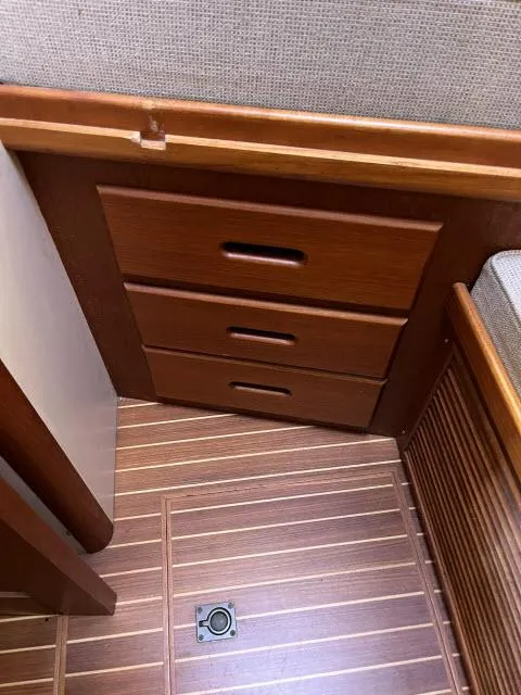 Slide: The Image of Wooden interior drawers on 1999 Grand Banks Eastbay 38 yacht with striped flooring. - 19