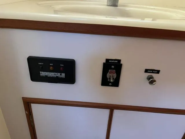 Slide: The Image of Control panel on a 1999 Grand Banks Eastbay 38 yacht interior. - 31