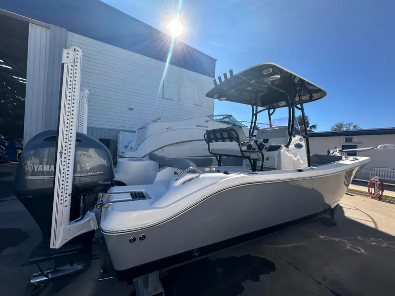 Slide: The Image of 2022 NauticStar Legacy 2302 boat with Yamaha engine in sunlight. - 14