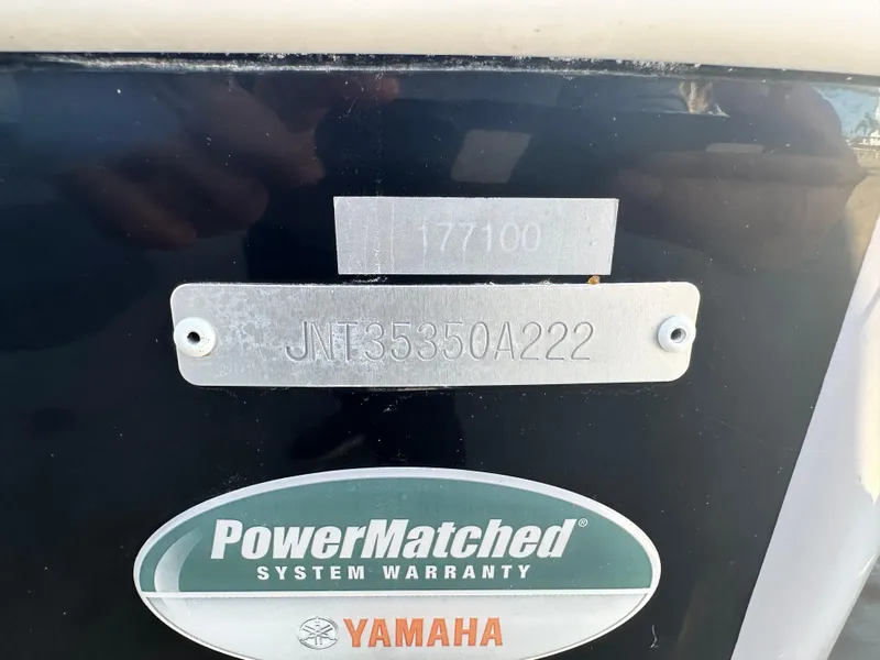 Slide: The Image of NauticStar Legacy 2302 boat, 2022 model, Yamaha PowerMatched warranty label. - 19