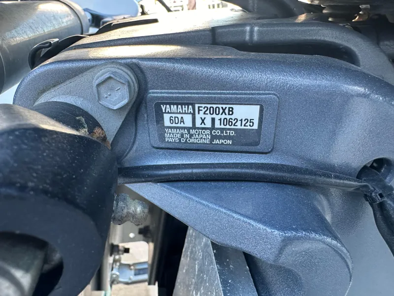 Slide: The Image of Close-up of Yamaha F200XB engine on 2022 NauticStar Legacy 2302 boat. - 23