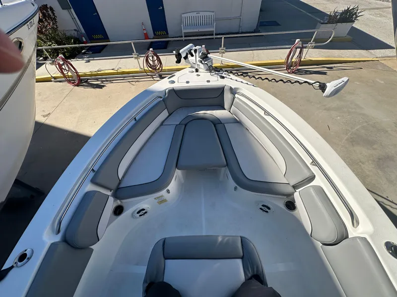 Slide: The Image of 2022 NauticStar Legacy 2302 boat interior with cushioned seating and modern design. - 40