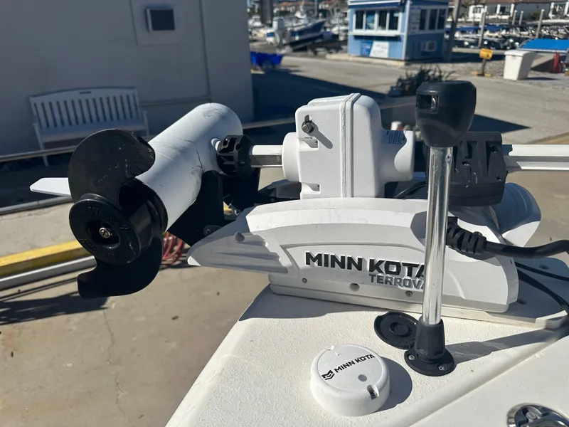 Slide: The Image of Minn Kota Terrova trolling motor on 2022 NauticStar Legacy 2302 boat at marina. - 43
