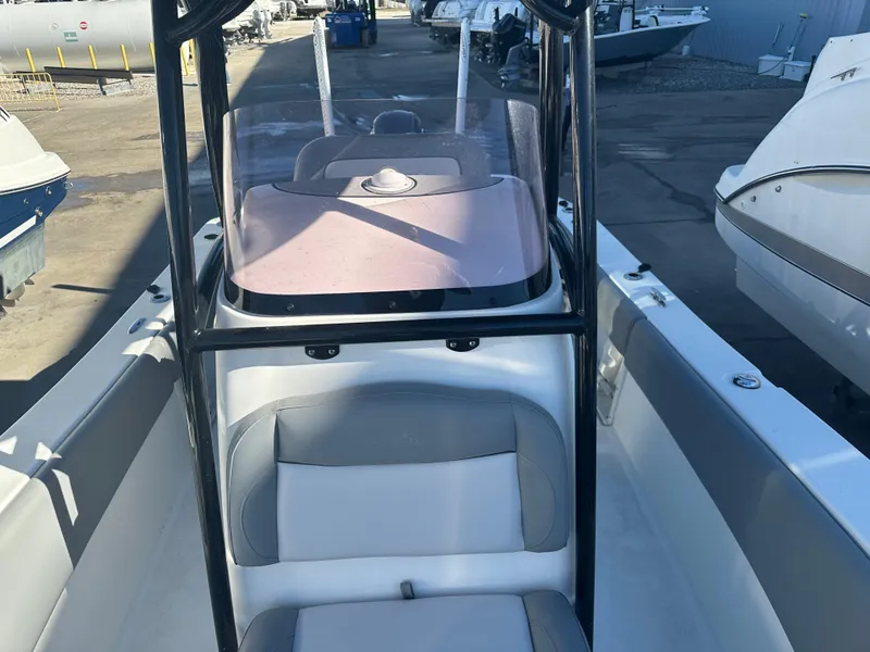 Slide: The Image of 2022 NauticStar Legacy 2302 boat interior with seating and console. - 49