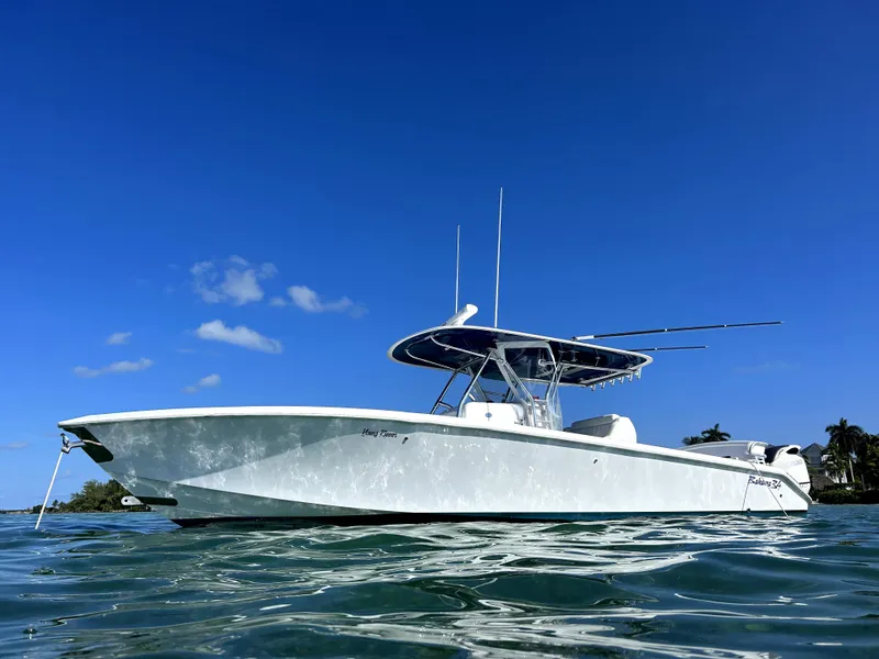Slide: The Image of 2015 Bahama 34 boat on clear blue water under a sunny sky. - 0