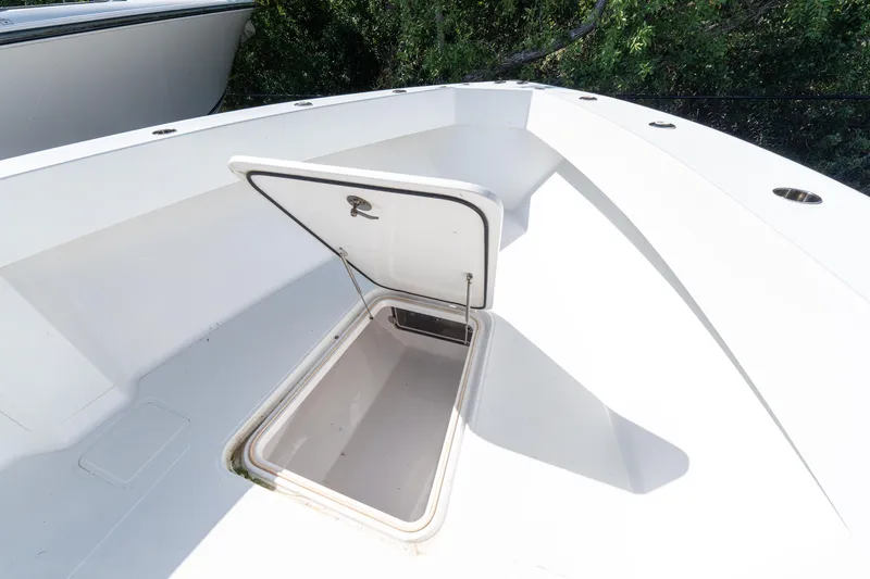 Slide: The Image of Open storage compartment on 2015 Bahama 34 boat deck. - 13