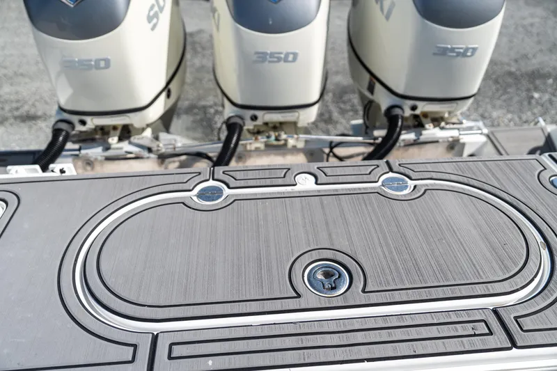 Slide: The Image of Bahama 34 boat with three Suzuki 350 engines, 2015 model, featuring a sleek deck design. - 15