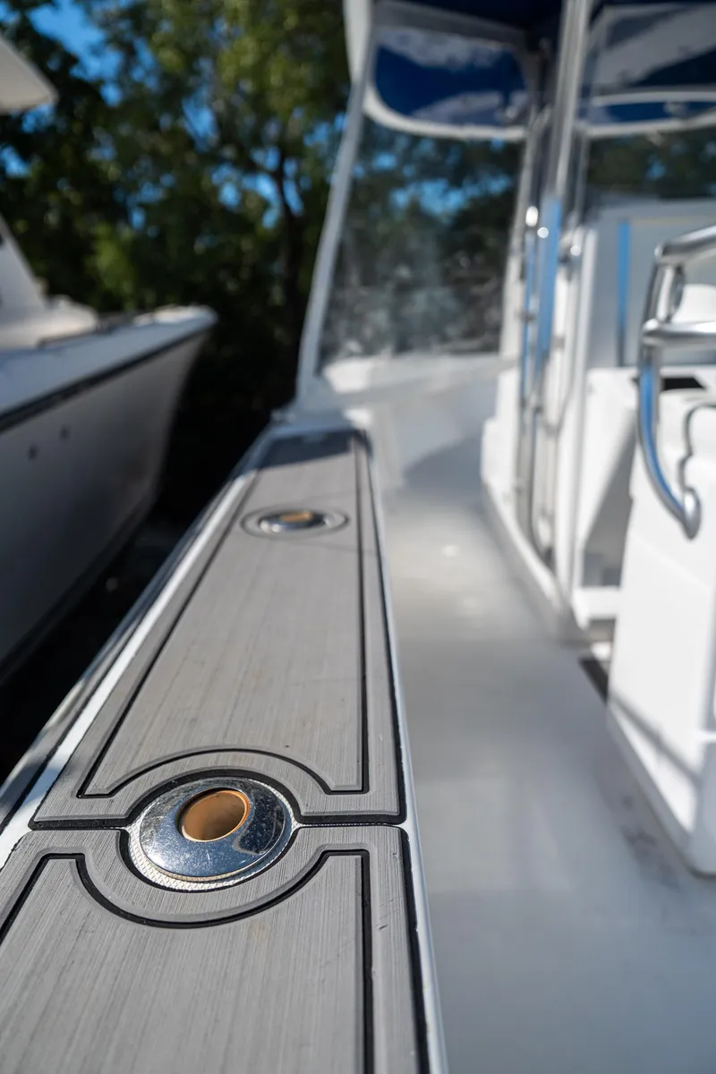 Slide: The Image of 2015 Bahama 34 boat deck detail with sleek design and modern fittings. - 16