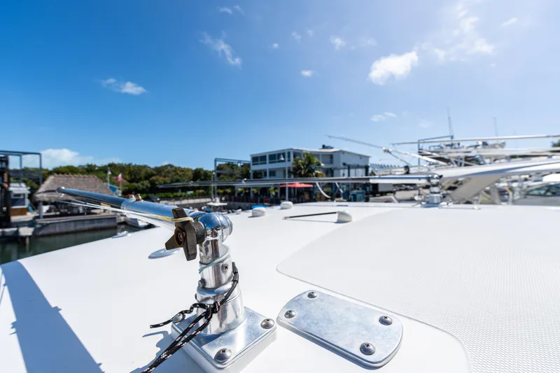 Slide: The Image of 2015 Bahama 34 boat deck with marina view under clear blue sky. - 22