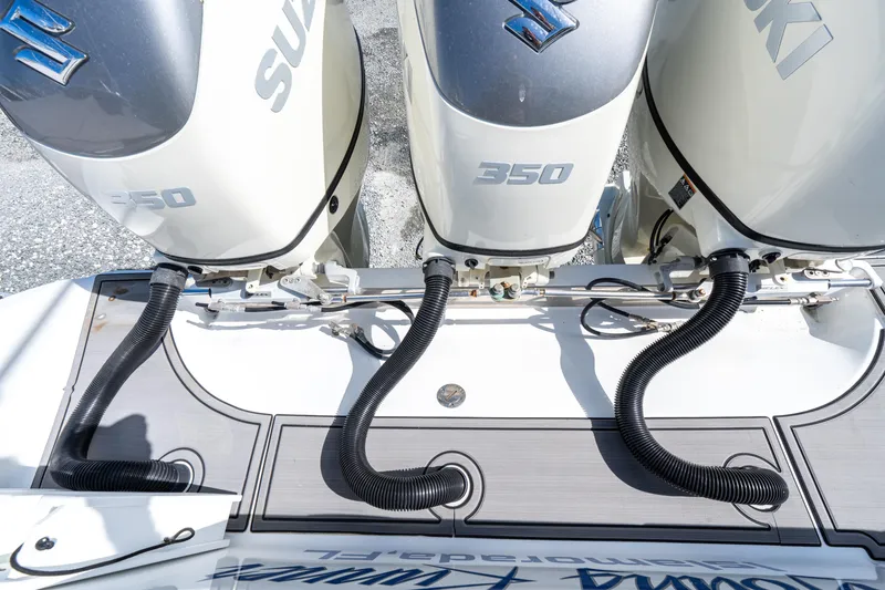 Slide: The Image of Triple Suzuki 350 outboard engines on a 2015 Bahama 34 boat. - 24