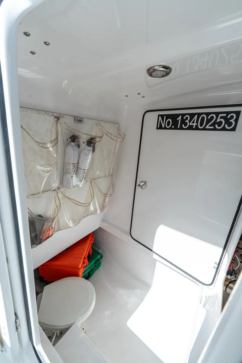 Slide: The Image of 2015 Bahama 34 boat interior with storage and safety equipment. - 28