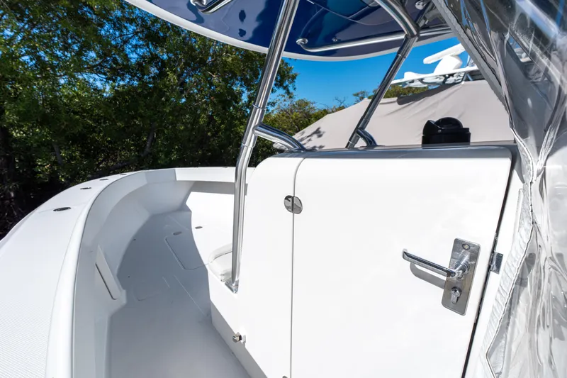 Slide: The Image of 2015 Bahama 34 boat interior with sleek white design and stainless steel features. - 31
