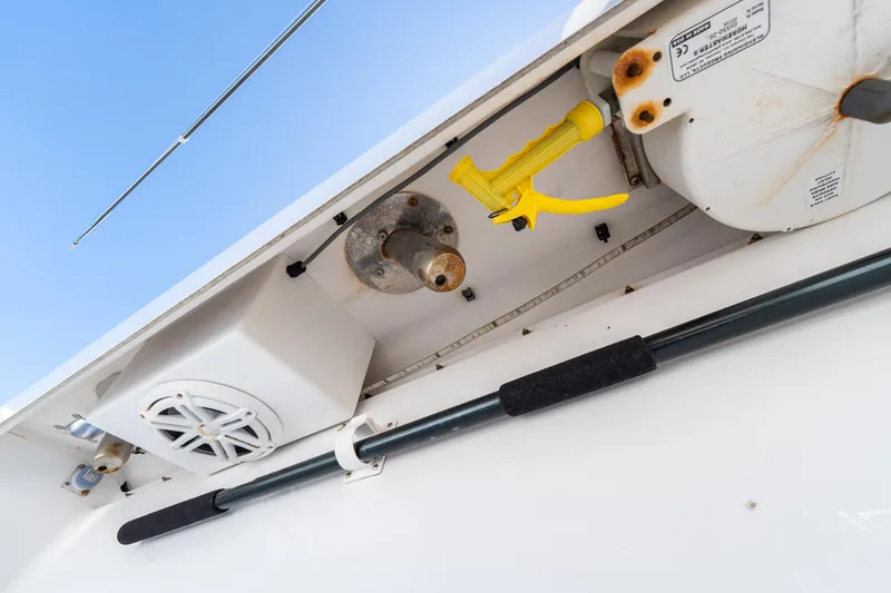 Slide: The Image of 2015 Bahama 34 boat interior with speaker, rod holder, and equipment. - 36