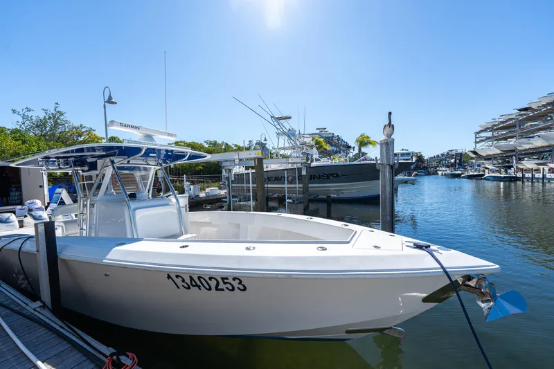 Slide: The Image of 2015 Bahama 34 boat docked in a sunny marina. - 40