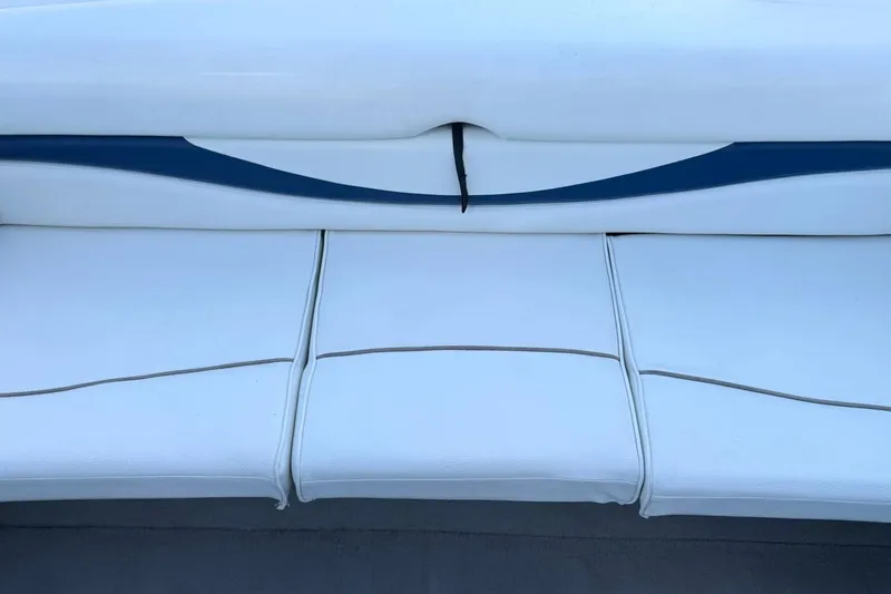 Slide: The Image of White seating on a 2002 Bayliner 185 BR boat. - 24