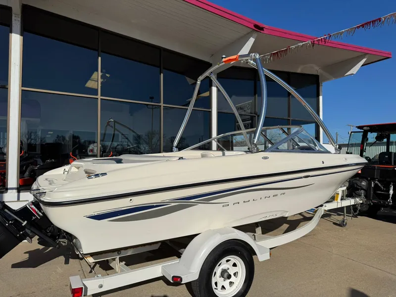 Slide: The Image of 2002 Bayliner 185 BR boat on trailer outside dealership. - 8