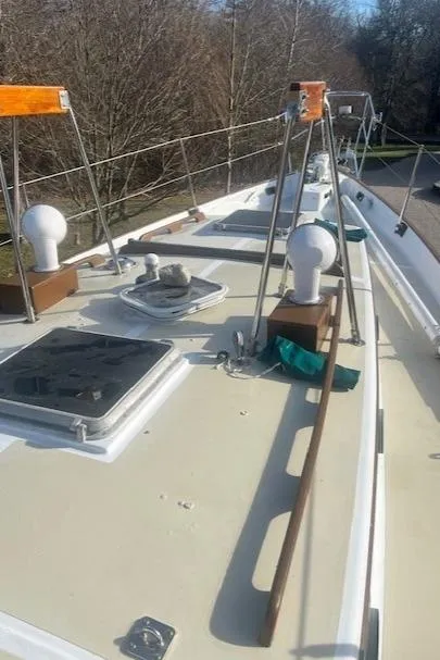 Slide: The Image of 1980 Kaiser Gale Force 34 sailboat deck with hatches and railings. - 10