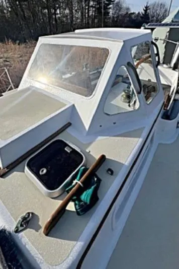 Slide: The Image of 1980 Kaiser Gale Force 34 boat with deck view and cabin details. - 14