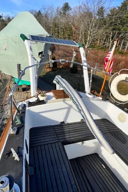 Slide: The Image of 1980 Kaiser Gale Force 34 sailboat cockpit with cover, docked outdoors. - 19